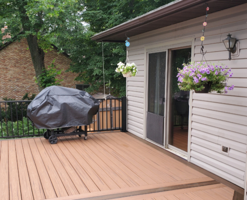 new deck with covered grill and black railings - Barefoot Construction Deck Construction, Basement Finishings and Home Additions