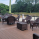 finished composite deck with patio furniture - Barefoot Construction Deck Construction, Basement Finishings and Home Additions