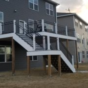 new deck with white and black railings - Barefoot Construction Deck Construction, Basement Finishings and Home Additions
