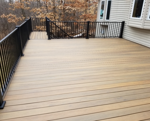 new wood deck with black railings - Barefoot Construction Deck Construction, Basement Finishings and Home Additions