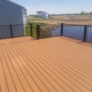 new deck with black railings - Barefoot Construction Deck Construction, Basement Finishings and Home Additions