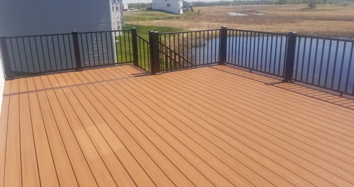 new deck with black railings - Barefoot Construction Building a Low-Maintenance Deck