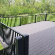 new deck with black railings - Barefoot Construction Deck Construction, Basement Finishings and Home Additions