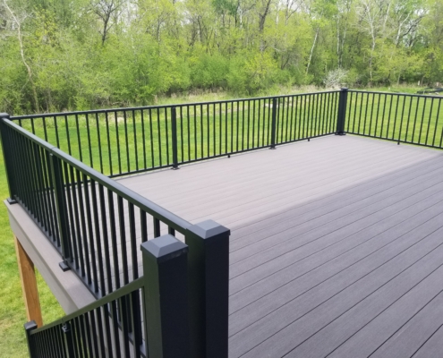 new deck with black railings - Barefoot Construction Deck Construction, Basement Finishings and Home Additions