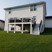 new deck white trimming and black railings - Barefoot Construction Deck Construction, Basement Finishings and Home Additions