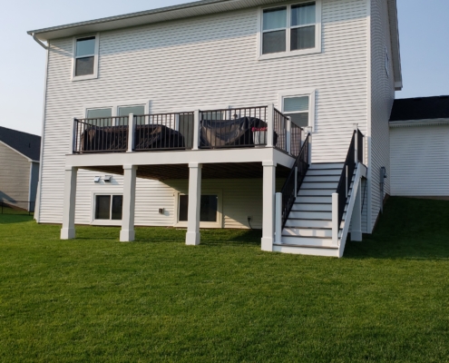 new deck white trimming and black railings - Barefoot Construction Deck Construction, Basement Finishings and Home Additions