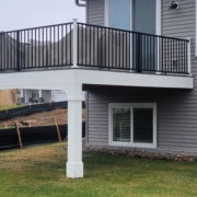 new deck with black railings - Barefoot Construction Deck Construction, Basement Finishings and Home Additions