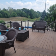 new deck with a pool view and patio furniture - Barefoot Construction Deck Construction, Basement Finishings and Home Additions