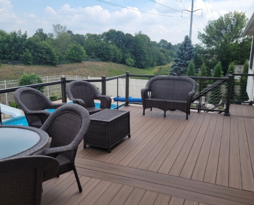 new deck with a pool view and patio furniture - Barefoot Construction Deck Construction, Basement Finishings and Home Additions