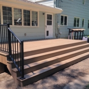new deck with steps and black railings - Barefoot Construction Deck Construction, Basement Finishings and Home Additions