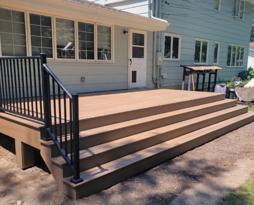 new deck with steps and black railings - Barefoot Construction Deck Construction, Basement Finishings and Home Additions