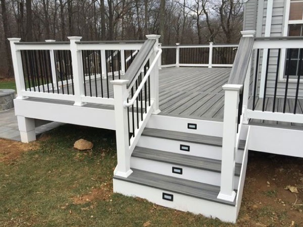 newly constructed grey and white deck - Barefoot Construction Deck Construction, Basement Finishings and Home Additions