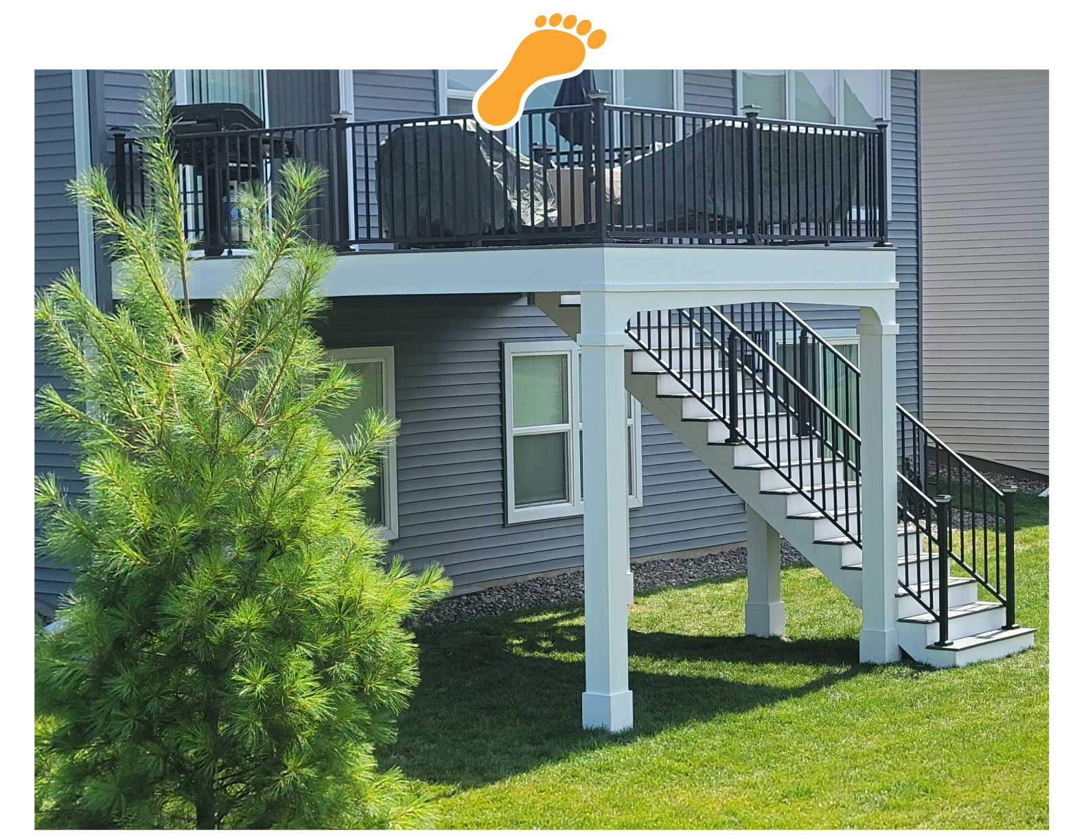 image a white deck with black railings - Barefoot Construction Composite Decks