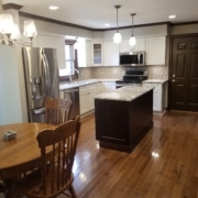 finished basement with wood floors and kitchenette - Barefoot Construction Deck Construction, Basement Finishings and Home Additions