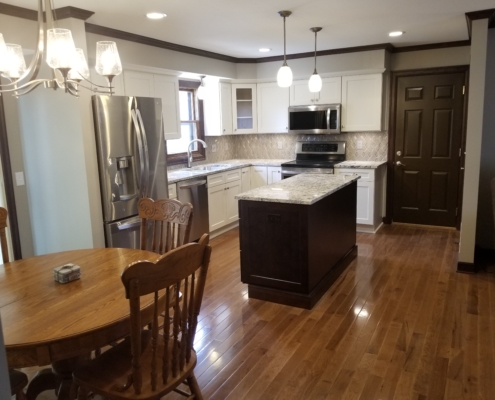 finished basement with wood floors and kitchenette - Barefoot Construction Deck Construction, Basement Finishings and Home Additions