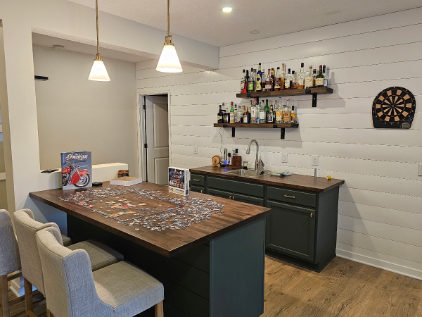 finished basement with a wet bar - Barefoot Construction Deck Construction, Basement Finishings and Home Additions