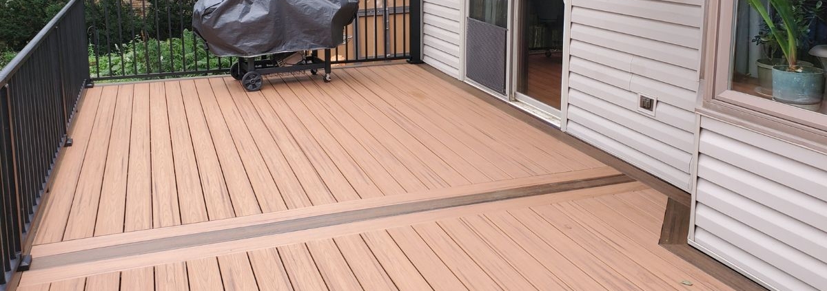 new composite deck with covered grill - Barefoot Construction composite decking