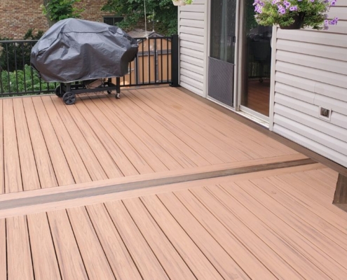 new composite deck with covered grill - Barefoot Construction composite decking