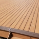 newly built composite deck with dark brown border - Barefoot Construction deck construction