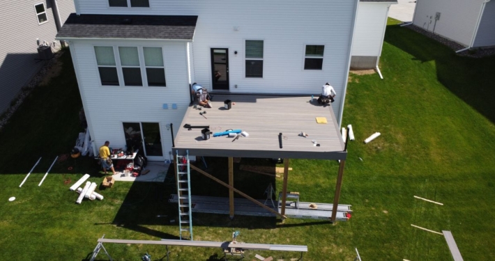 deck construction on a new build home - Barefoot Construction composite deck installation