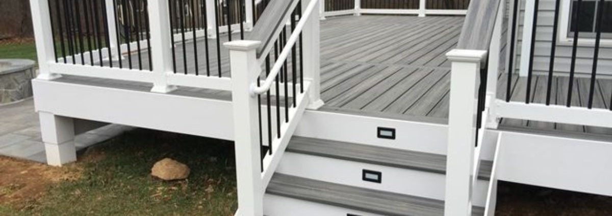 grey and white deck with black railings - Barefoot Construction Strategic Deck Lighting Ideas