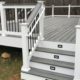 grey and white deck with black railings - Barefoot Construction Strategic Deck Lighting Ideas