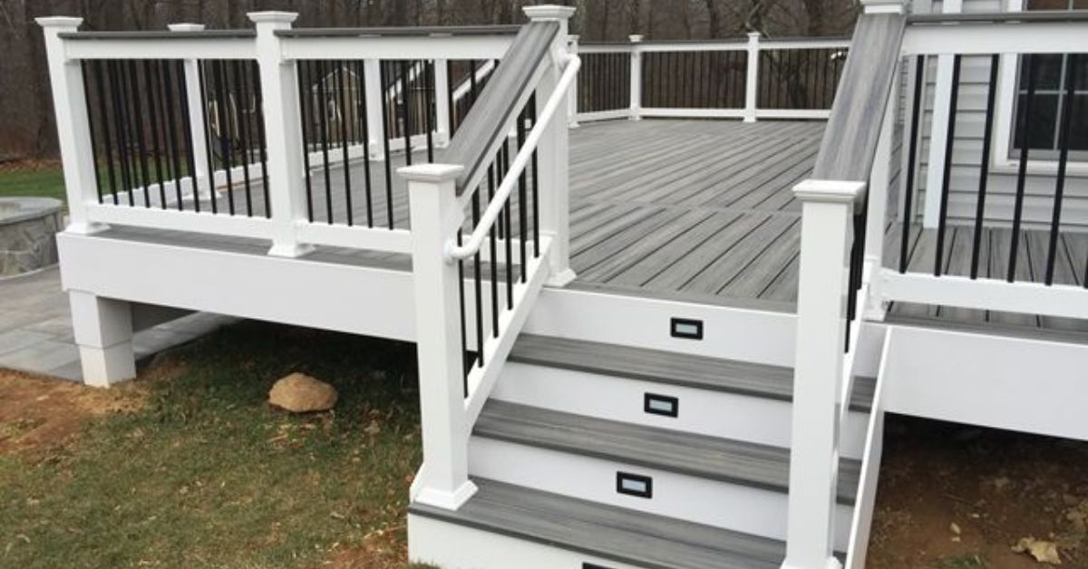 grey and white deck with black railings - Barefoot Construction deck construction