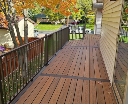 newly built deck with black railings - Barefoot Construction composite decking