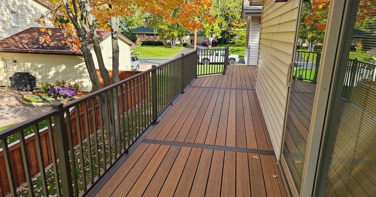 newly built deck with black railings - Barefoot Construction composite deck