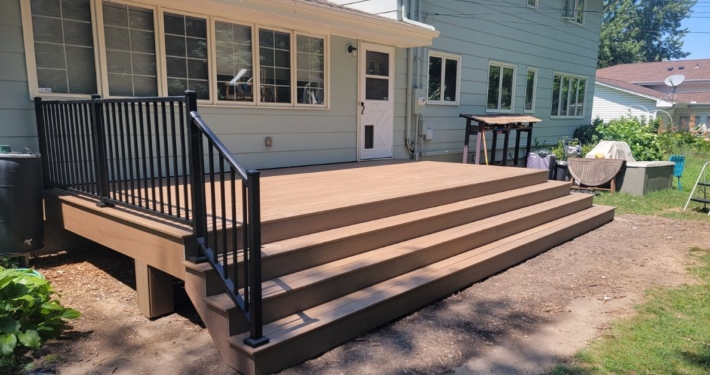new construction deck with black railings - Barefoot Construction composite deck construction