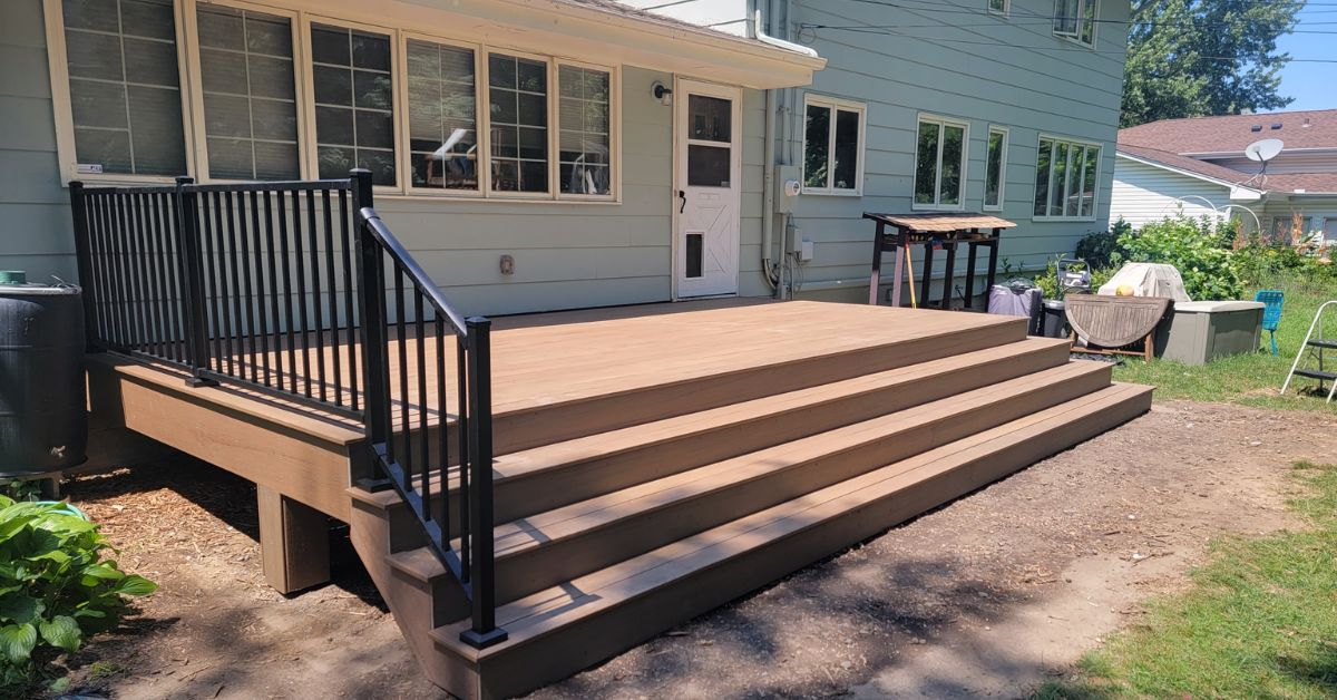 new construction deck with black railings - Barefoot Construction deck construction