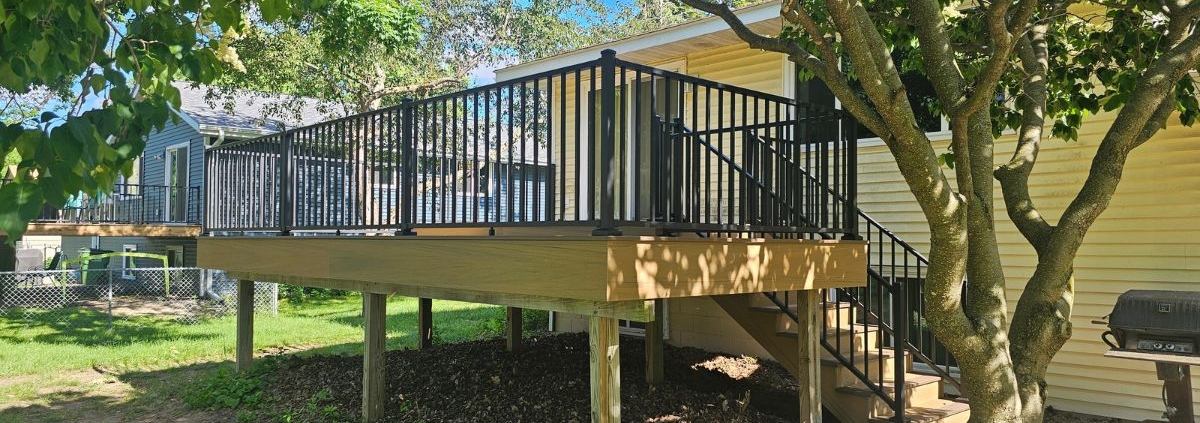 new construction deck with black railings - Barefoot Construction deck construction