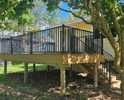 new construction deck with black railings - Barefoot Construction deck construction