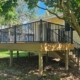 new construction deck with black railings - Barefoot Construction deck construction