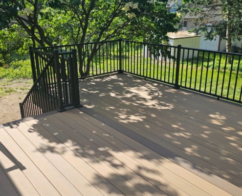 new construction deck with black railings - Barefoot Construction deck construction