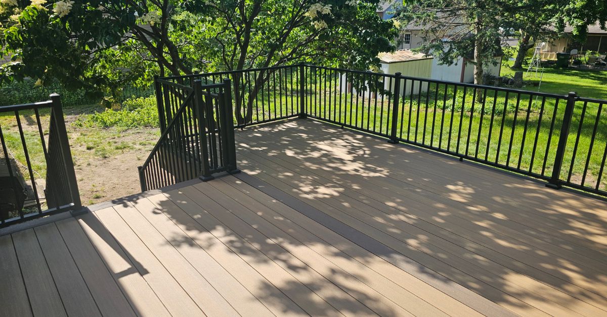 new construction deck with black railings - Barefoot Construction deck construction