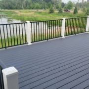 newly built deck with a pond view - Barefoot Construction composite decking