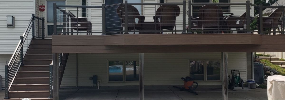 newly built deck with a pool - Barefoot Construction deck builders near