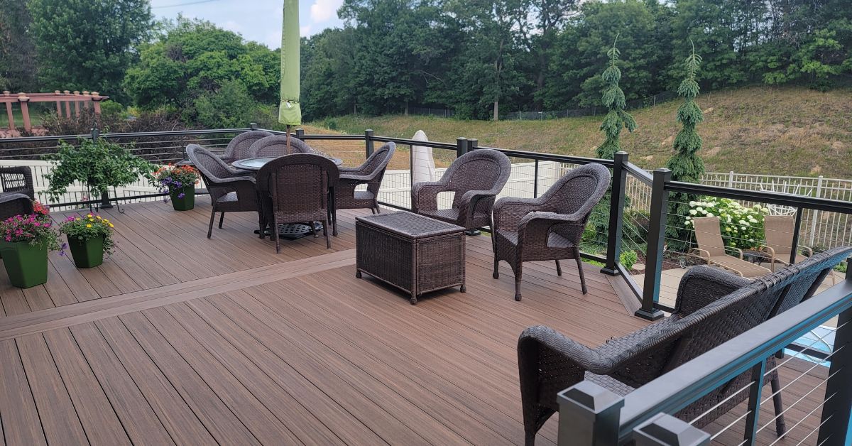 newly constructed deck with black railings - Barefoot Construction deck construction