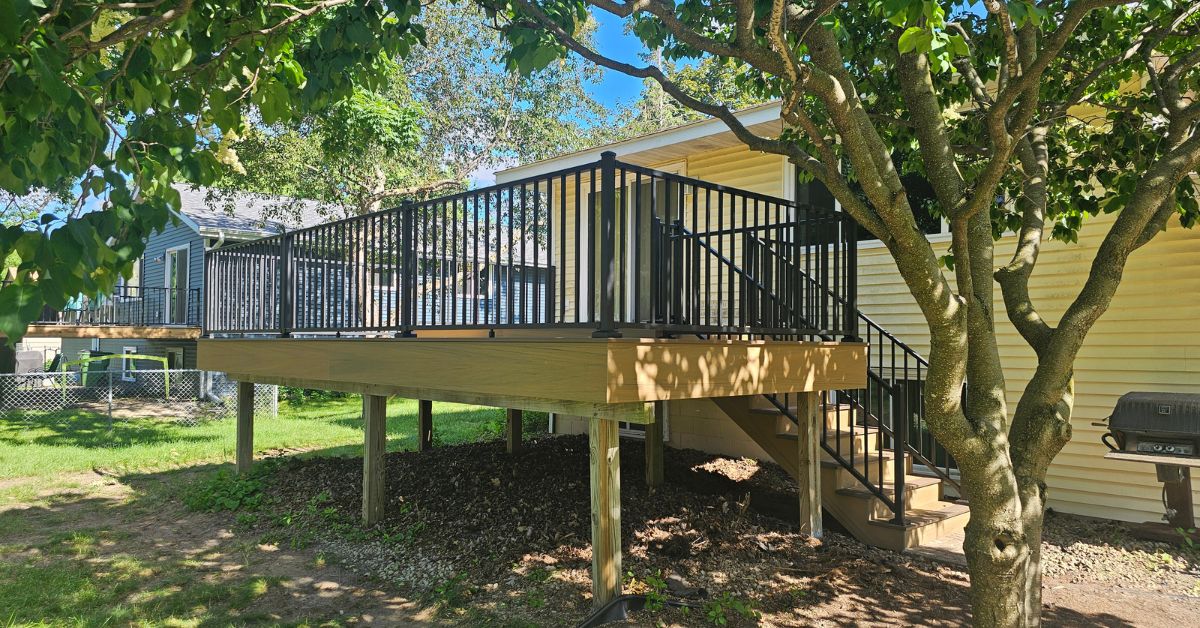 new construction deck with black railings - Barefoot Construction deck construction
