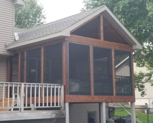 exterior view of a screened in porch - Barefoot Construction Screened Porch vs Deck Minnesota