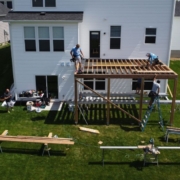 workers building a new wood deck - Barefoot Construction deck builder