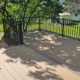 newly built deck with black railings - Barefoot Construction composite decking