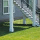 close up of white deck columns and footings - Barefoot Construction deck construction