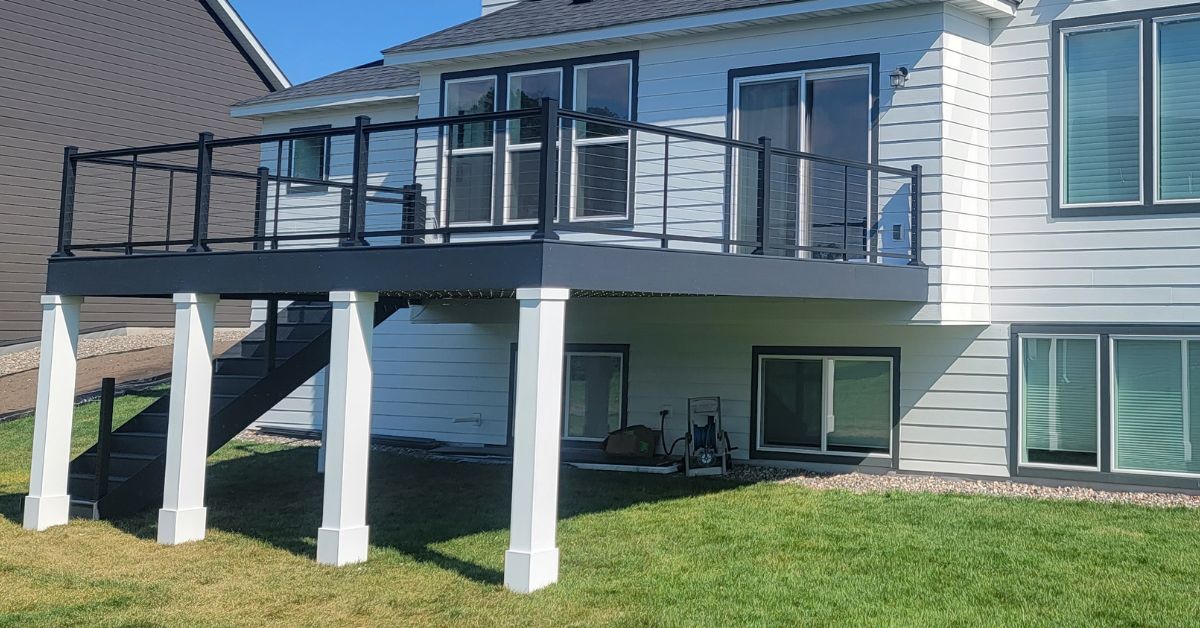 close up of white deck columns and footings - Barefoot Construction deck construction