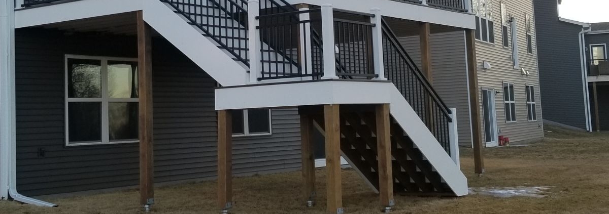 two level deck with white trim - Barefoot Construction custom deck
