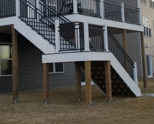 two level deck with white trim - Barefoot Construction custom deck