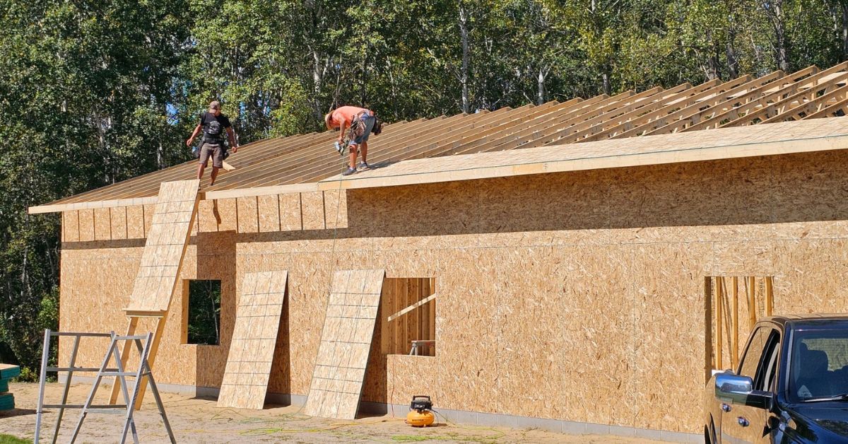 men working on roof of a new home addition - Barefoot Construction home addition Ham Lake Minnesota