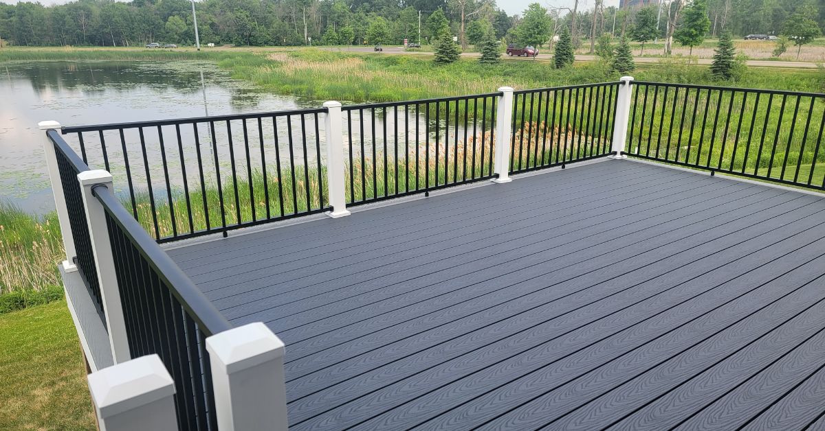 composite deck with black railings - Barefoot Construction composite decking