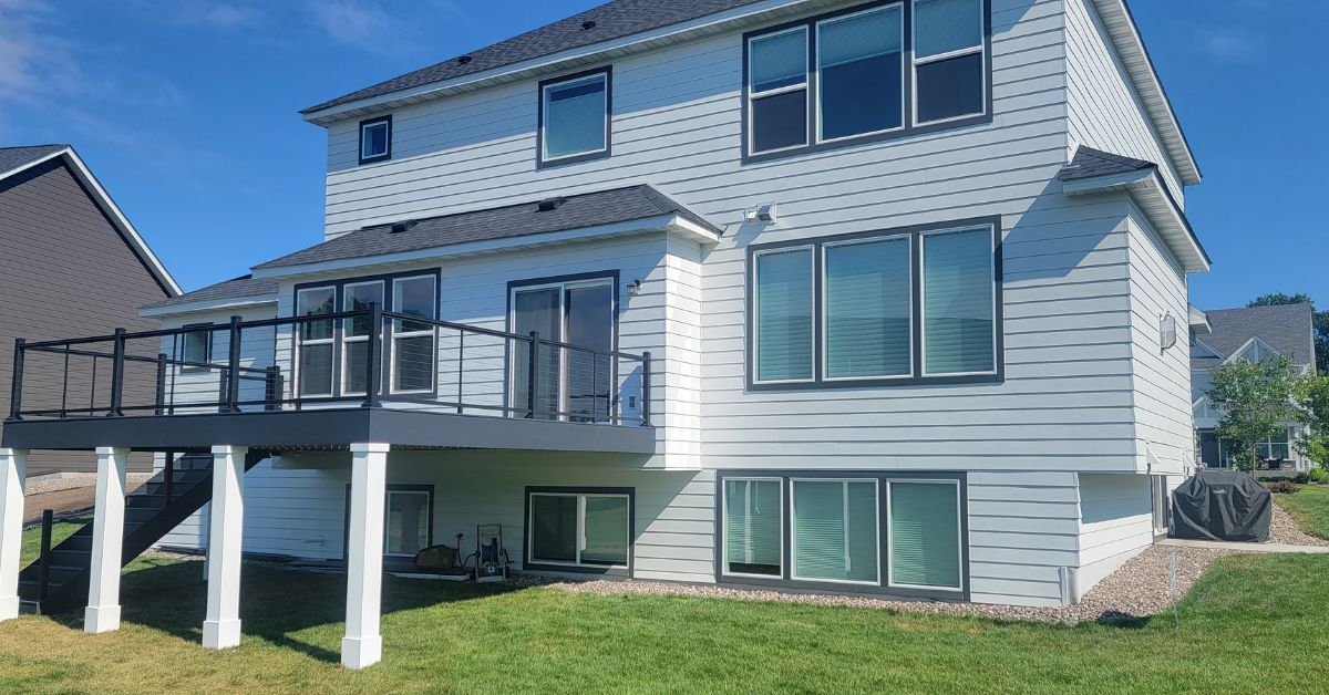 composite deck with white columns - Barefoot Construction deck builders near